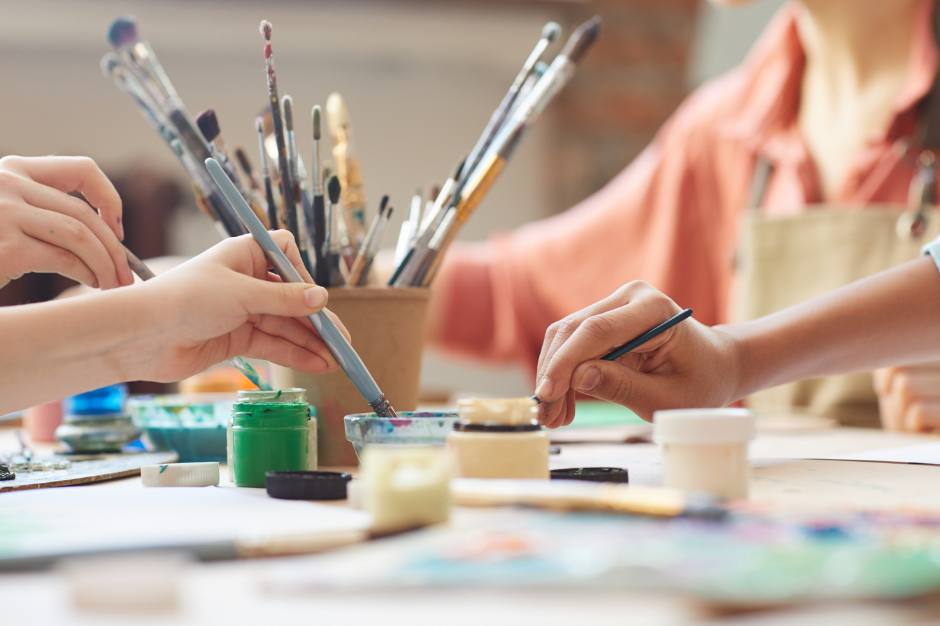 Children Using Watercolor Paint at Workshop